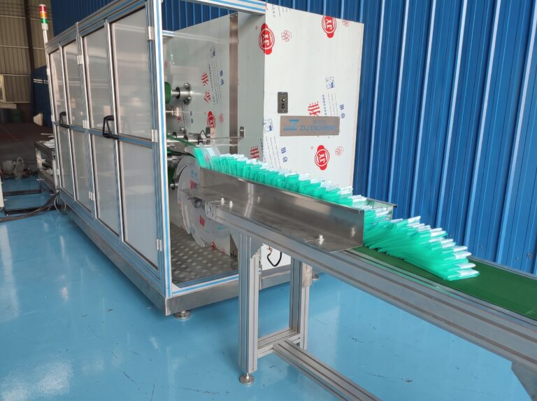 Folded medical drape packs from a hole drape folding machine