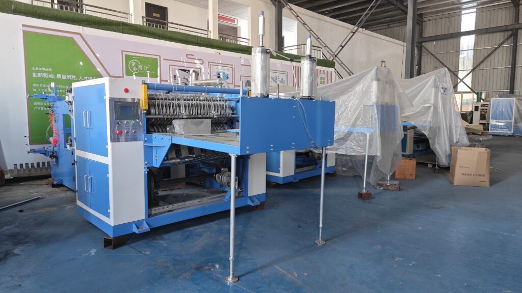 High-configuration pop-up aluminum foil folding machine inspected and ready for shipment in the production workshop——zxj machinery