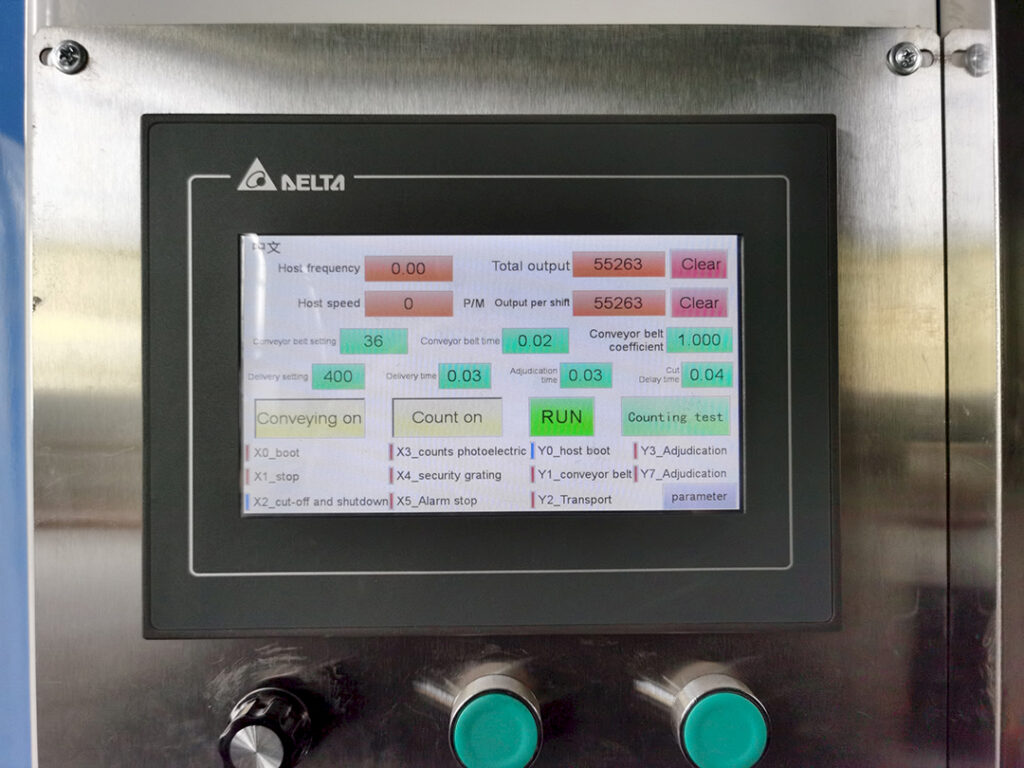 PLC touchscreen control panel on a perm paper folding machine