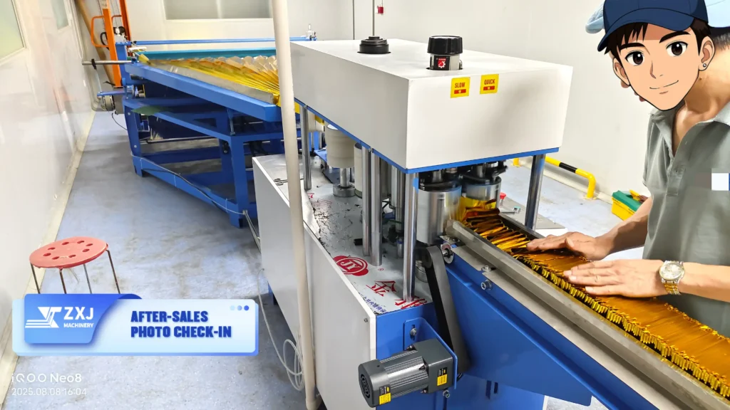 Technicians from ZXJ Machinery providing after-sales support at a customer’s factory, with the emergency blanket folding machine running in normal production.