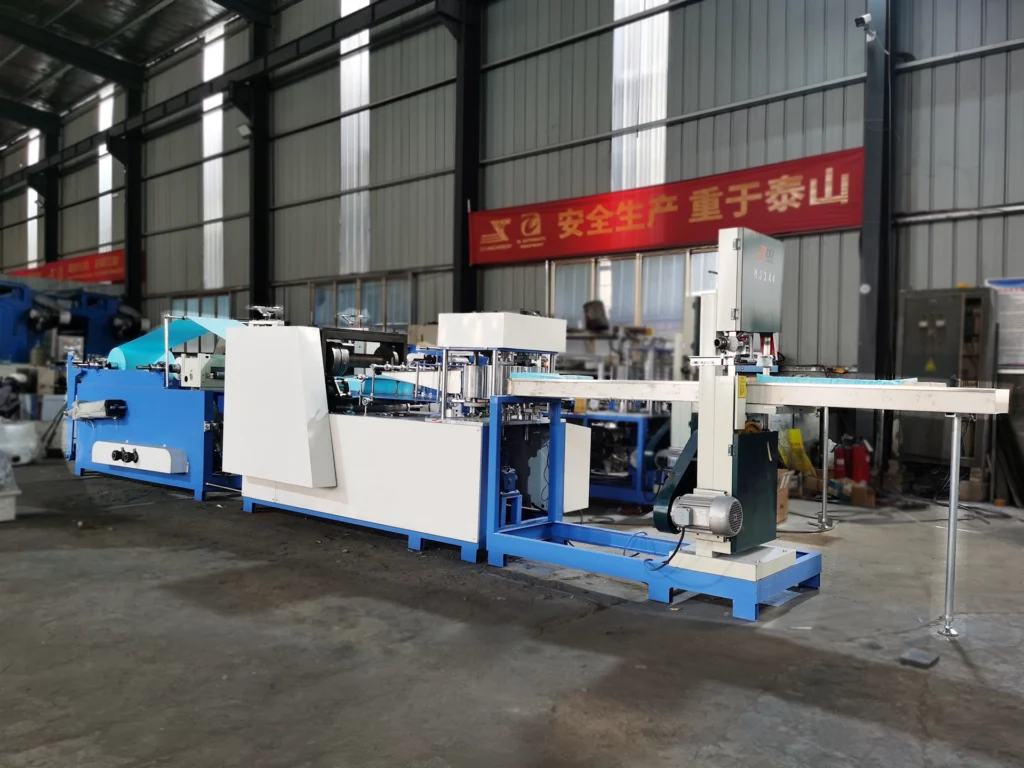 Dental bibs converting machine for producing disposable dental bibs