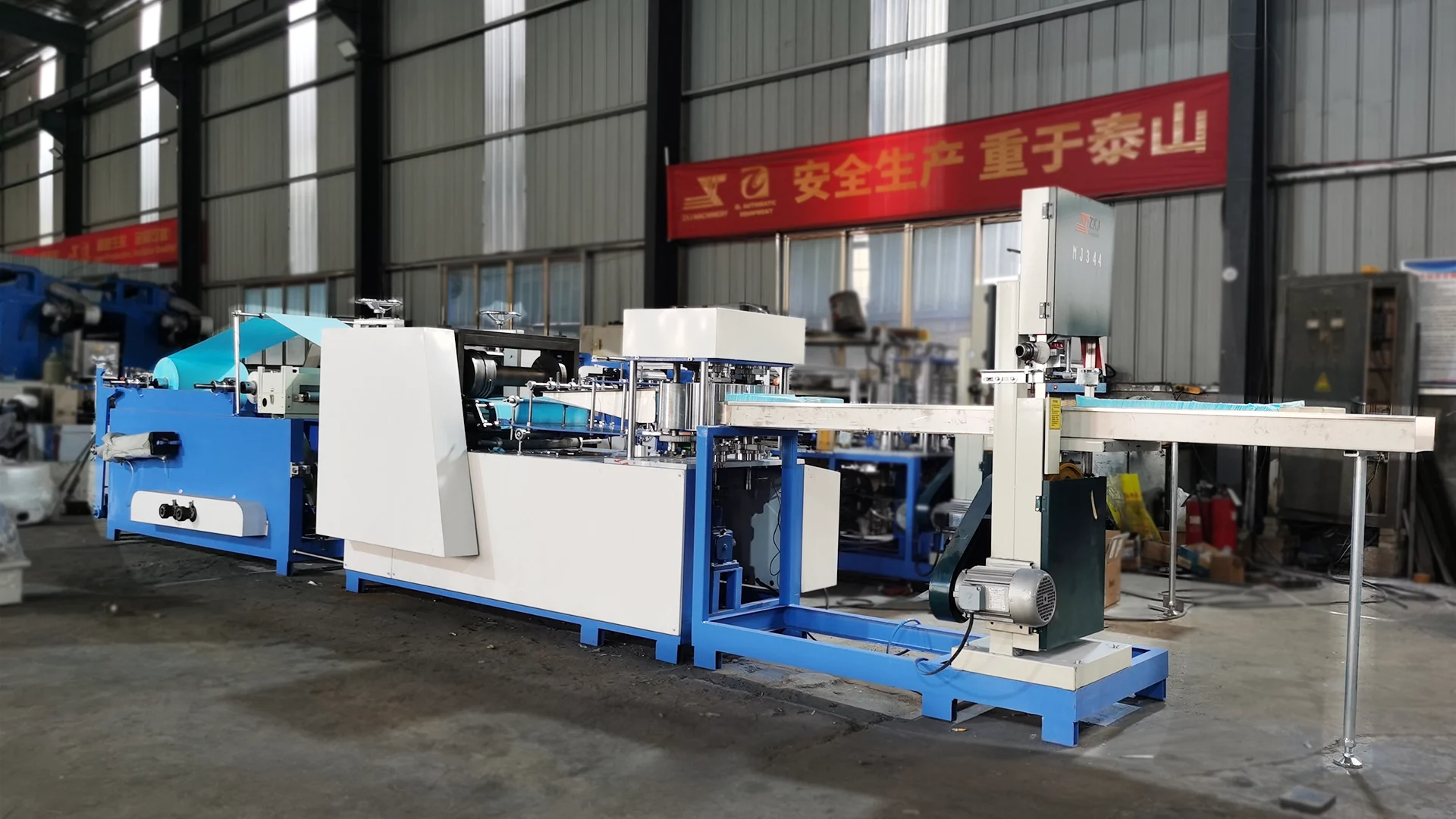Dental bibs converting machine for producing disposable dental bibs