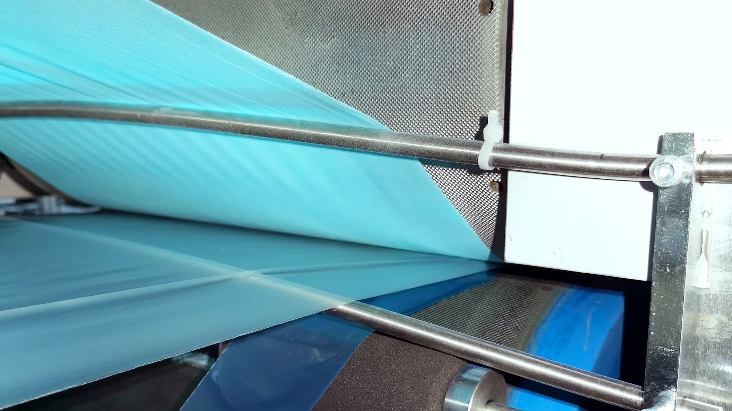 Dental bibs converting machine for producing disposable dental bibs