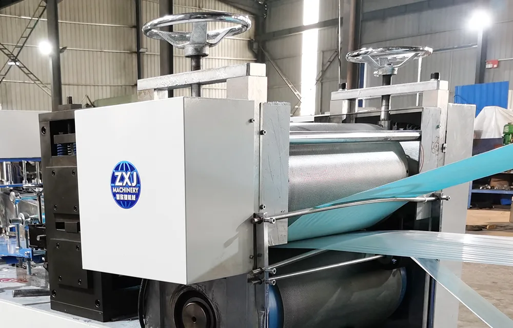 Heavy-duty mechanical composite embossing roller for stable dental bib lamination.