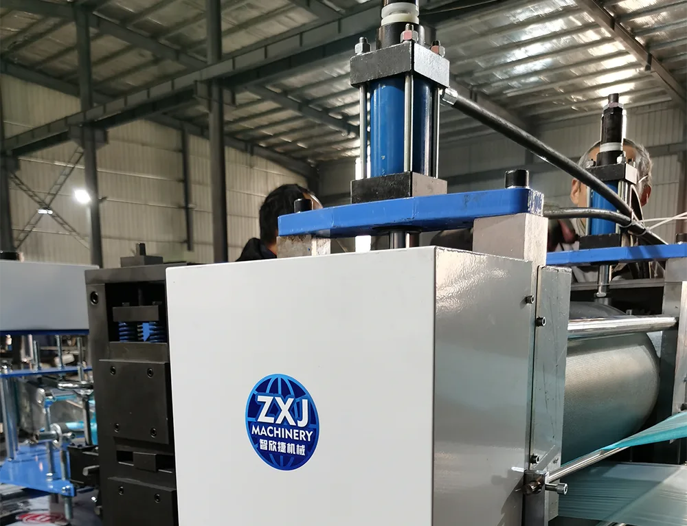 Pneumatic composite embossing roller system with large-bore air cylinders for precise pressure control.