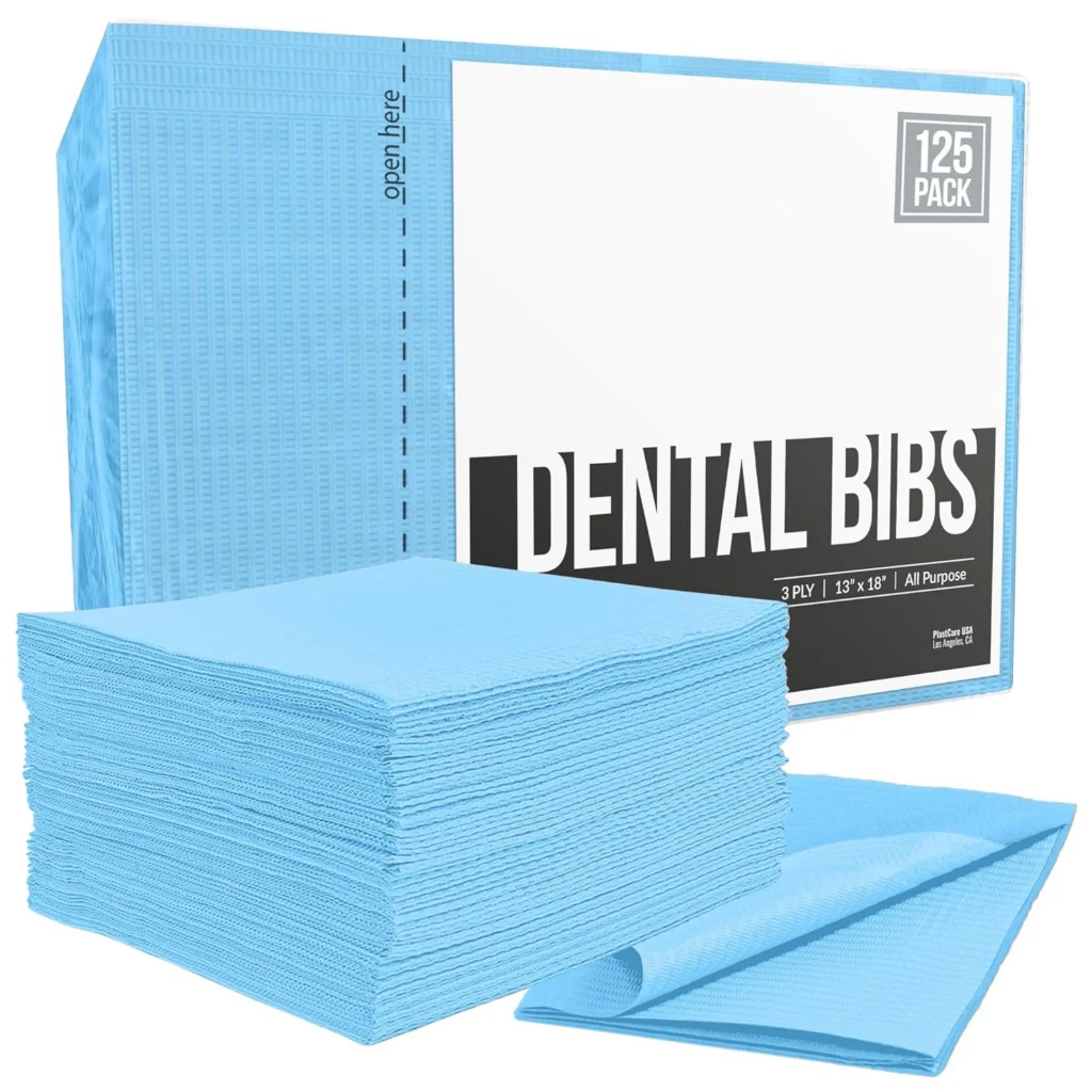 Dental bibs converting machine for producing disposable dental bibs